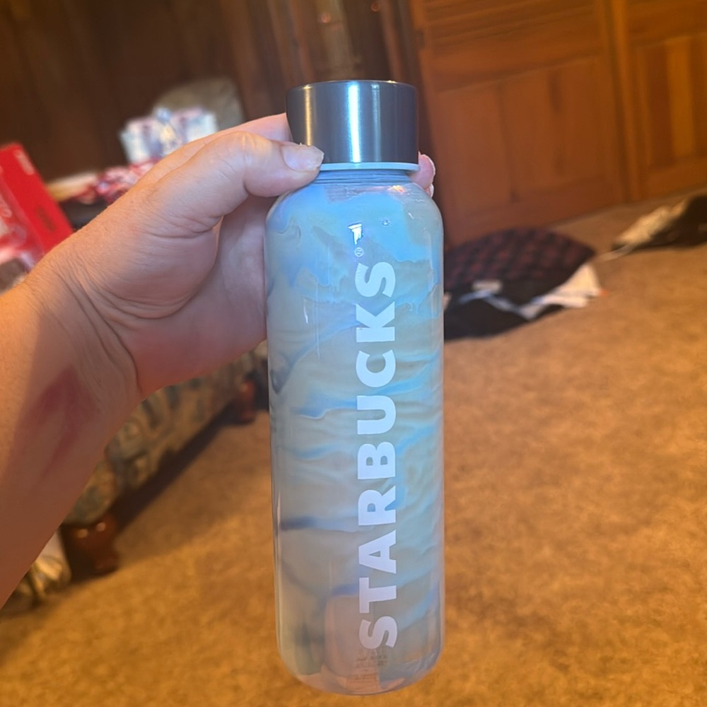 A water art glass hydration bottle by Starbucks